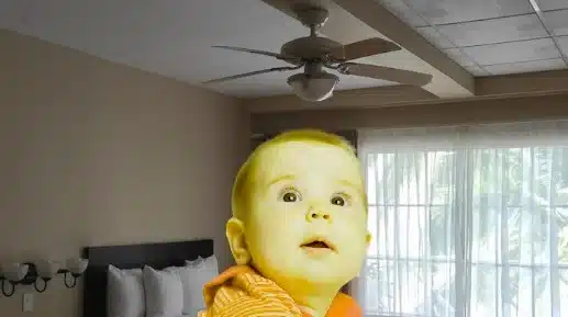 Baby Looking at Ceiling Fan and Smiling